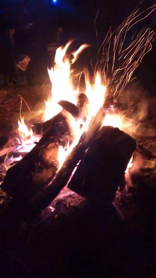 Sitting round the fire pit at our retreat venue in Devon