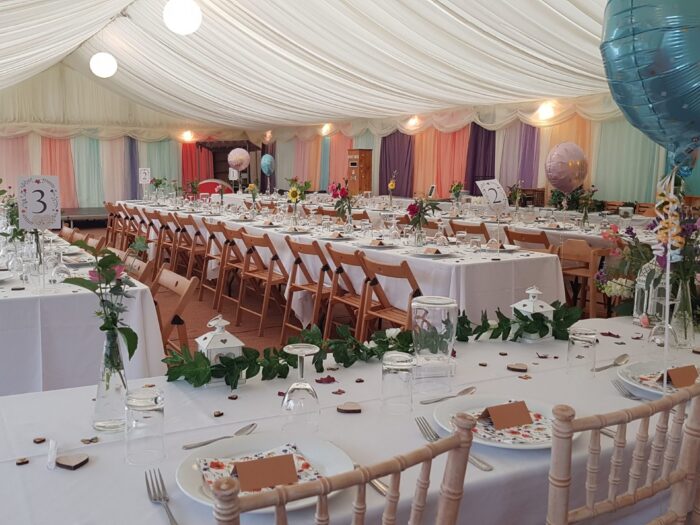 The marquee filled with trestle tables ready for the wedding feast in Devon