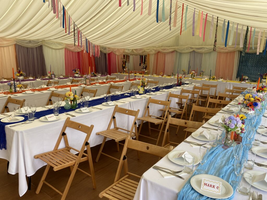 Trestle tables set up in the marquee in the Devon countryside